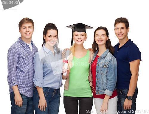 Image of group of standing smiling students with diploma