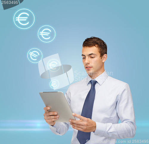 Image of buisnessman with tablet pc and euro icons