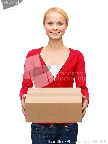 Image of smiling woman in casual clothes with parcel box