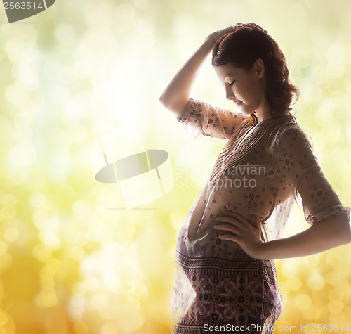 Image of silhouette picture of pregnant beautiful woman