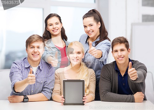 Image of smiling students with blank tablet pc screen