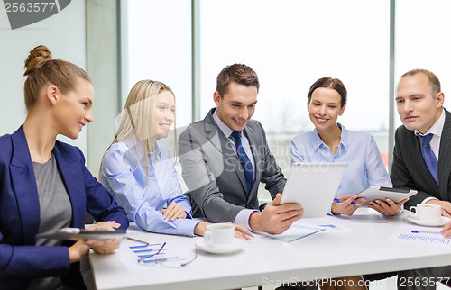 Image of business team with tablet pc having discussion