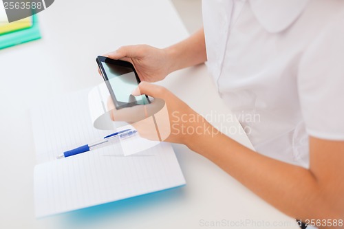 Image of girl with smartphone at school