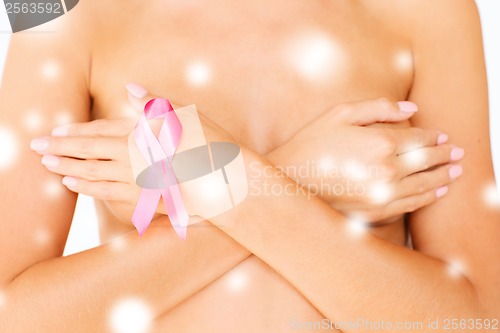 Image of naked woman with breast cancer awareness ribbon