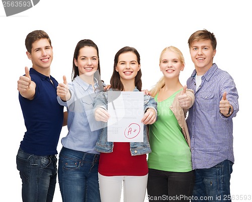 Image of group of students showing test and thumbs up