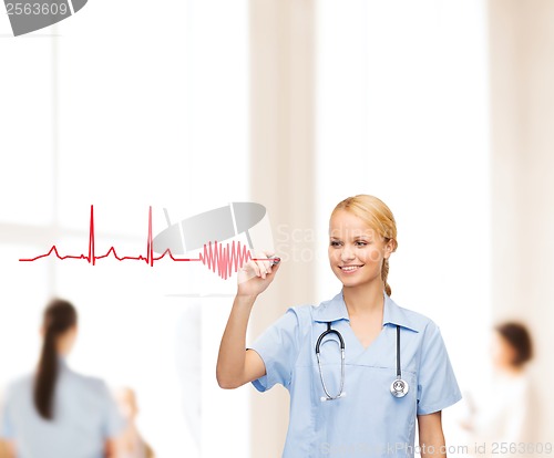 Image of smiling doctor or nurse drawing electrocardiogram