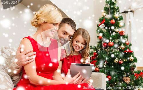 Image of smiling family with tablet pc