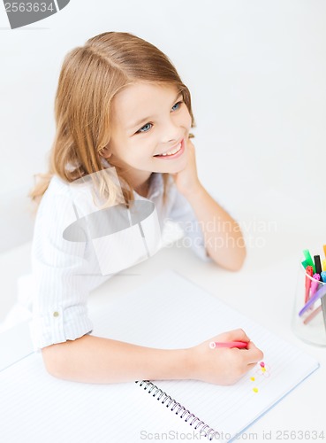 Image of little student girl drawing at school