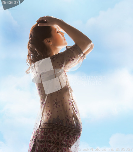 Image of silhouette picture of pregnant beautiful woman