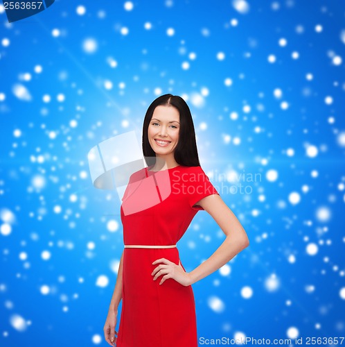 Image of smiling young woman in red dress