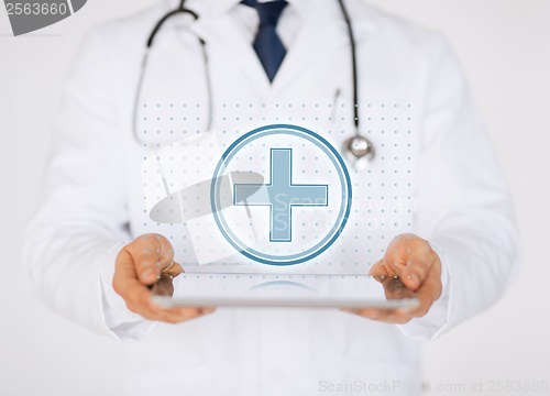 Image of male doctor with stethoscope holding tablet pc