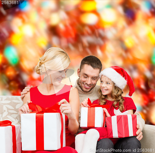 Image of happy family opening gift boxes