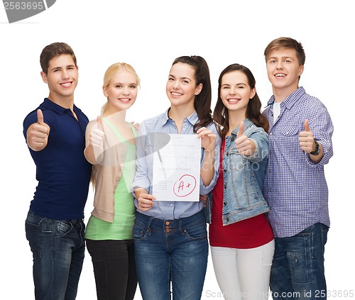 Image of group of students showing test and thumbs up
