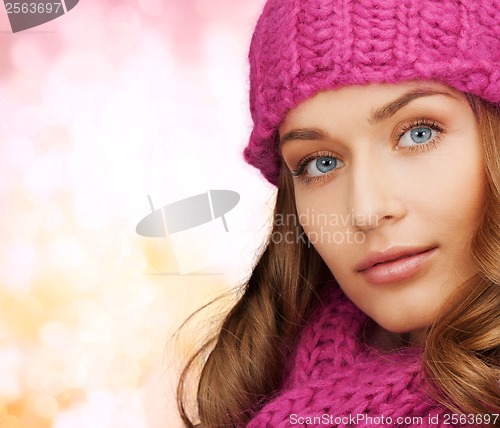 Image of woman in pink hat and scarf