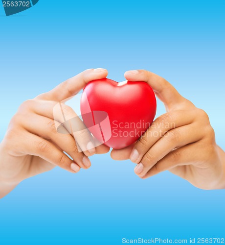 Image of woman hands with heart