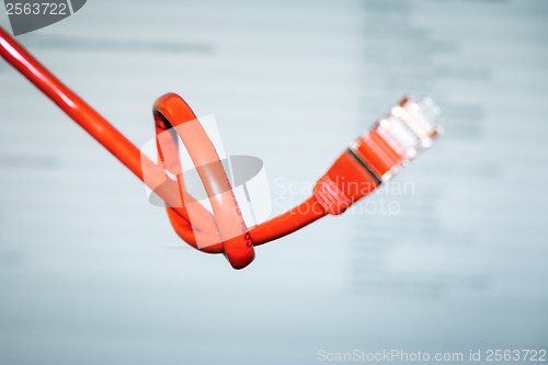 Image of red networking cable with a knot