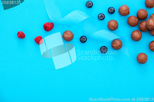 Image of chocolate pralines and fresh berries