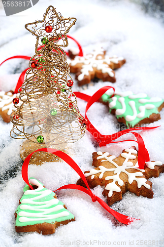 Image of Christmas cookies and golden tree.