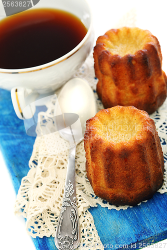 Image of French small cake and cup of tea.