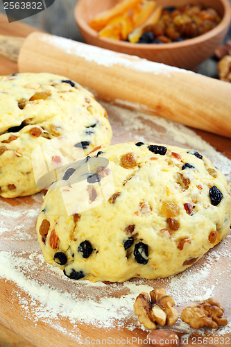 Image of Dough with candied fruits and nuts for Christmas baking.