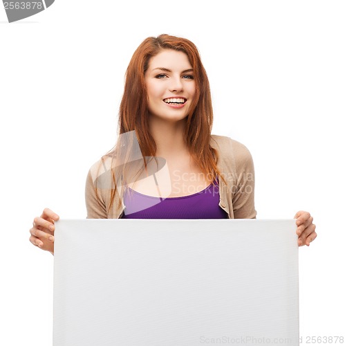 Image of smiling young girl with blank white board