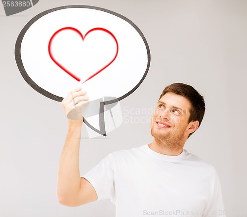 Image of smiling young man with text bubble and heart in it