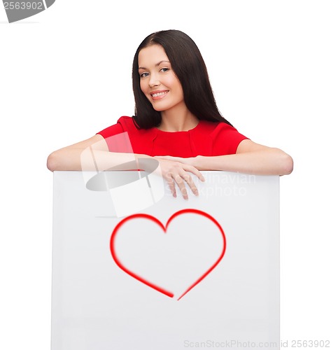Image of young woman with white board and heart on it