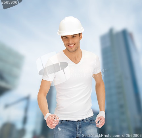 Image of handsome builder in white helmet