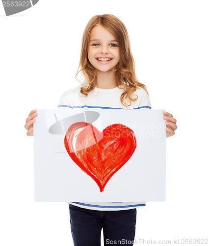 Image of smiling little child holding picture of family