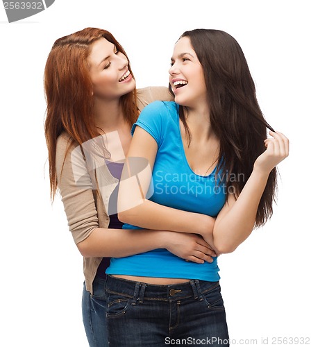 Image of two laughing girls looking at each other