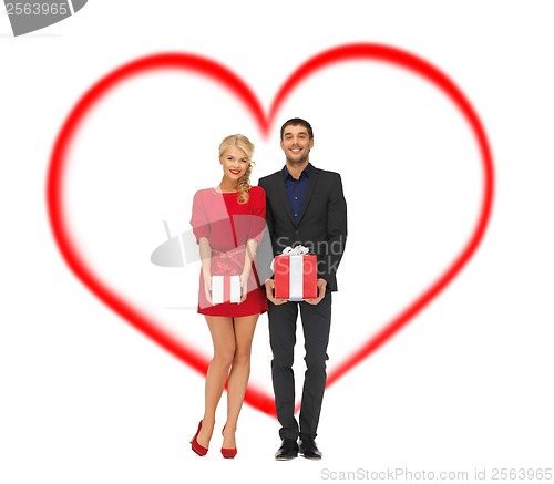 Image of smiling man and woman with gift boxes
