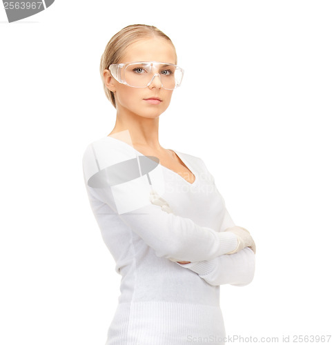 Image of woman in protective glasses and gloves