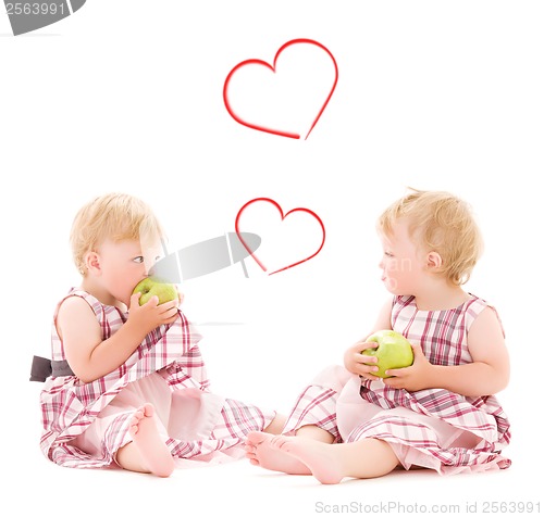 Image of two adorable twins over white