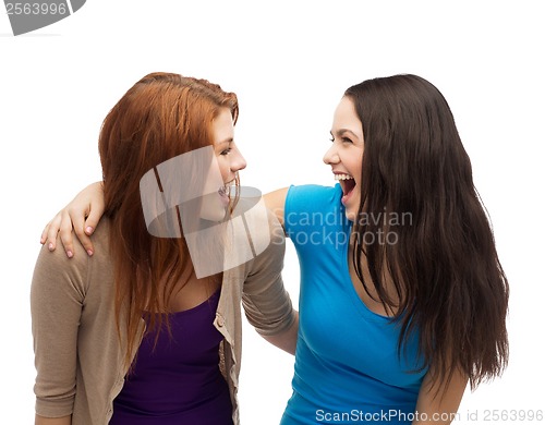 Image of two laughing girls looking at each other