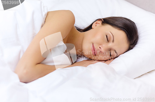 Image of beautiful woman sleeping in bed