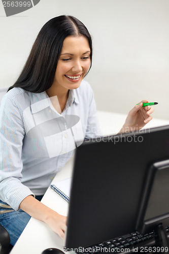 Image of smiling businesswoman or student studying