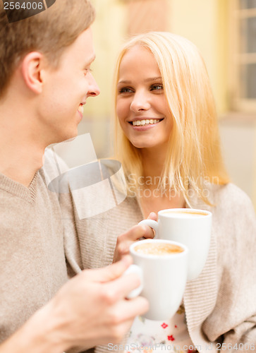 Image of romantic happy couple in the cafe