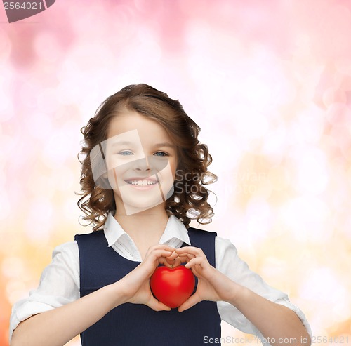 Image of beautiful girl with small heart