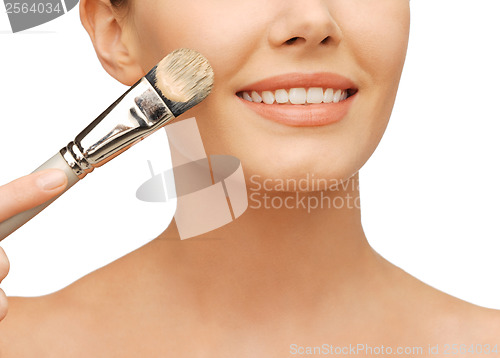 Image of beautiful woman with brush