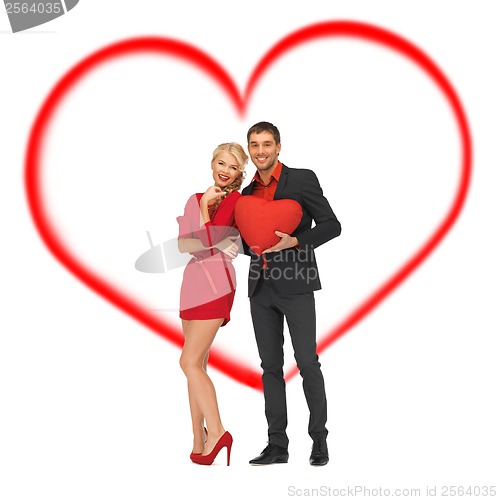 Image of beautiful couple holding big heart