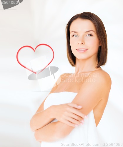 Image of beautiful woman standing in towel