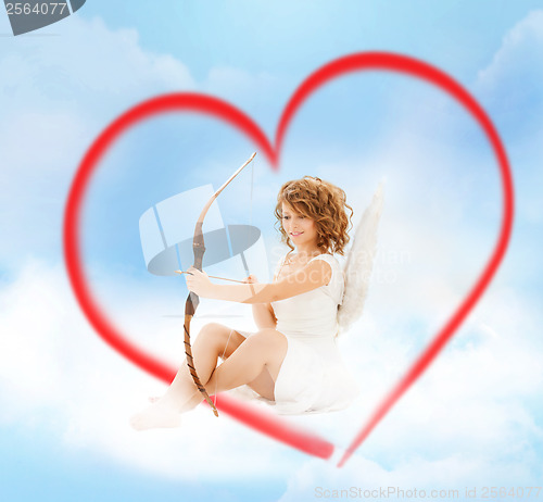 Image of happy teenage angel girl with bow and arrow