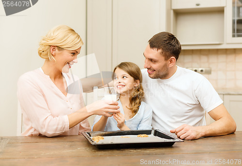 Image of happy family making cookies at home