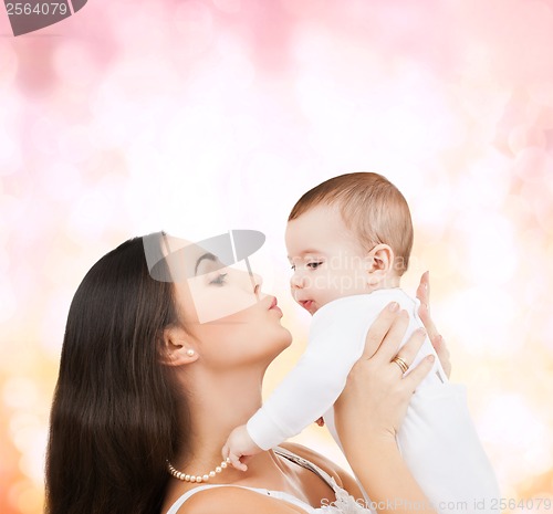 Image of happy mother kissing her child