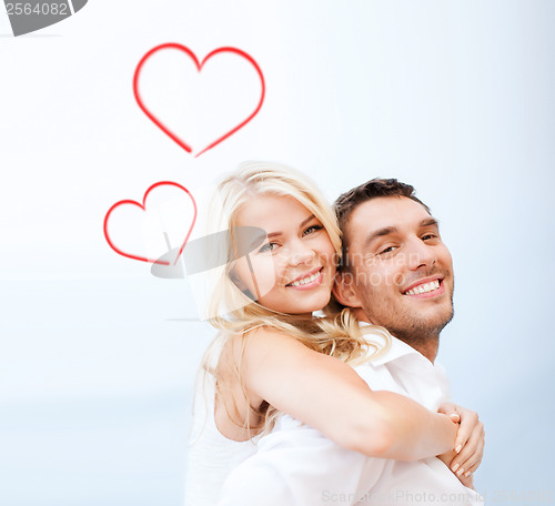 Image of couple having fun on the beach