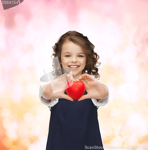 Image of beautiful girl with small heart