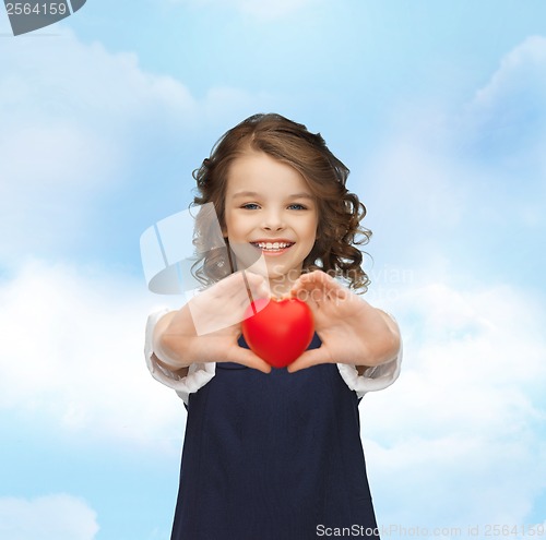 Image of beautiful girl with small heart