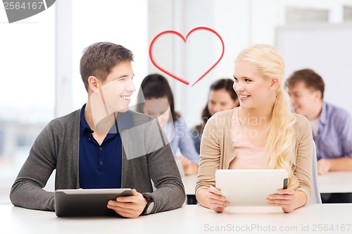 Image of students looking at tablet pc in lecture at school