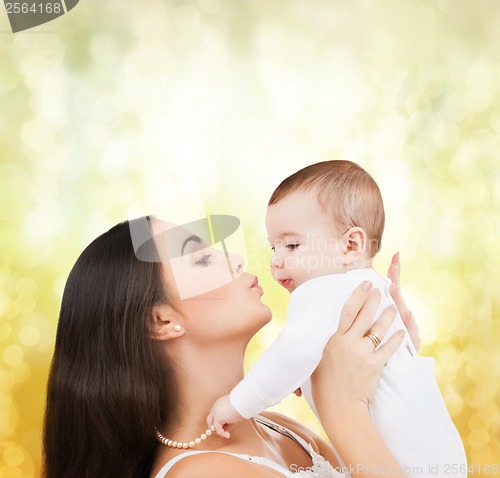 Image of happy mother kissing her child
