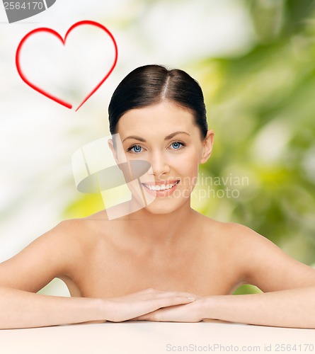 Image of face and hands of beautiful woman